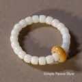 Natural white Bodhi root bead bracelet featuring a single yellow Ping'an donut charm - Plain Ping'an Style / 8x10 / Milky White with Yellow Bead