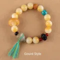 Natural white Bodhi root bead bracelet featuring a grey gourd pendant and blue tassel - Moving Ring Gourd Style / White