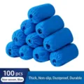 100 Stück verstärkte blaue Einweg-Überschuhe aus Vliesstoff für den Heimgebrauch - 100 Stück Packung / Blau