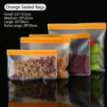 Reusable orange EVA food storage bags in four sizes for kitchen organization - S / Orange
