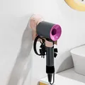 Suction cup hair dryer holder with dual hooks for bathroom wall organization - Pink