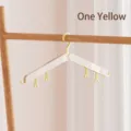 Portable yellow foldable travel hanger with clips for space-saving organization - 1 Piece / Yellow