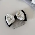 Detail of a Korean-style polka dot bow hair comb for elegant hairstyles - Double Layer Bow Insert Comb / Black White Polka Dot
