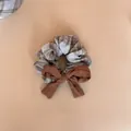 Close-up detail of a Korean style brown plaid hair scrunchie with elegant oversized bow - Bow Scrunchie / Blue and Brown Plaid