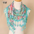 Floral lace triangular scarf featuring hollow-out designs and fringe on a mannequin - Style 4