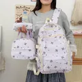 Vue détaillée de l'ensemble de 3 sacs d'école violets avec motifs nœuds et pois. - Violet
