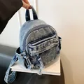 Stylish acid-wash denim backpack for women, a versatile and lightweight schoolbag. - Dark Blue