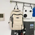 Stylish beige PU leather backpack hanging in a modern lifestyle room - One Size / White