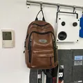 Vintage brown leather backpack with multiple zipper pockets for daily casual travel use - One Size / Brown