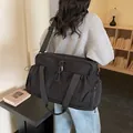 Versatile large black travel duffel bag with handles and adjustable shoulder strap - 47x21x28cm / Black