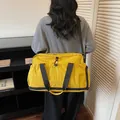 Large yellow travel bag featuring dry-wet separation design and durable black straps - 47x21x28cm / Yellow