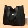 Minimalist black large capacity Oxford cloth tote bag with side pockets and wide shoulder strap - One Size / Black