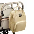 Multifunctionele beige canvas luiertas rugzak hangend aan een baby kinderwagen. - Khaki