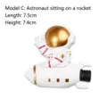 Cute 3D resin astronaut figurine sitting on a rocket for wall switch decoration - 7.5x7.4cm / Astronaut On Rocket (Style C)