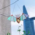 Stained glass style bat pendant with pressed flowers hanging outdoors against city background - Acrylic Pendant - Cyan Bat