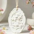 Macro detail view of elegant white lily flower embossed plaster aroma diffuser stone - White Lily (Unscented)