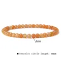 Detailed close-up of a 4mm orange natural stone bead bracelet with 19cm length specifications - 4mm / Yellow Aventurine
