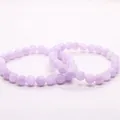 Macro view of two natural icy lavender purple quartz beaded bracelets on white background - 6mm (60 Pcs) Strand / Natural Lavender Jade (Clean Creamy Texture)