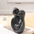 Elegant minimalist black couple embrace statue with heart for modern home shelf decor - Couple Embracing Heart Statue (Large) / Matte Black