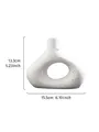 Moderne Scandinavische witte O-vormige harsvaas met zwarte stippen, 15,5 cm breed - S / Gevlekte Steen