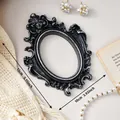 European vintage style black and silver resin photo frame with ornate floral relief - Height 13cm Width 10cm