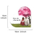 Detailed view of the heart-shaped acrylic memorial plaque with a couple under cherry tree - Cherry Blossom Couple Style / 10x10cm