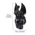 Black resin Halloween dragon perched on skull figurine with height and width dimensions - Black