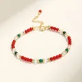 Detailed view of an elegant multicolor beaded bracelet featuring red, green and clear crystals. - Red Agate Malachite