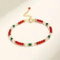 Delicada pulsera artesanal de cuentas de cristal con cuentas rojas y detalles de malaquita - Ágata Roja Malaquita