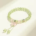 Elegant prehnite and rose quartz beaded bracelet featuring a pink butterfly charm - Butterfly Pendant / Light Green & Pink