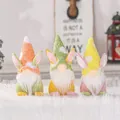 Trio of colorful plush Easter gnomes with bunny ears on soft white faux fur surface - Tricolor Rabbit Theme (D1-3/4/5) / 3 Pieces/Pack