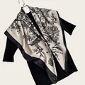 Detailed view of a 90cm twill square scarf with elegant ink wash floral and bird print - Artistic Ink Painting Square Scarf / Champagne / 90cm