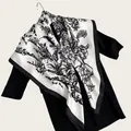 Close-up of a sophisticated ink-wash floral silk scarf draped on a black dress. - Artistic Ink Painting Square Scarf / White / 90cm