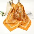 Detailed view of yellow paisley satin square scarf draped over a white handbag - 90x90cm / Yellow (AR-4)