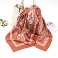 Macro detail of the 90cm rust brown satin square scarf with white paisley pattern - 90x90cm / Caramel (AR-6)