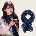 Close-up of a lightweight cotton-linen floral pleated scarf with an elegant navy blue pattern - 180cm Long / Dark Blue Floral