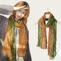 Detail view of a lightweight cotton linen floral scarf with pleated texture and green trim. - Yellow Green Floral