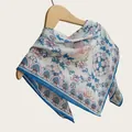 Detailed macro shot of a lightweight Chinese style floral cotton square scarf with blue borders - 70cm / Blue & White