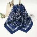 Detailed view of a navy blue satin square scarf with a white paisley pattern texture - 90x90cm / Navy (AR-1)