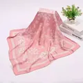 Detailed shot of a 90cm pink satin square scarf featuring white paisley flower patterns - 90x90cm / Pink (AR-5)