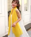 Detailed view of lightweight yellow sun protection shawl worn by model outdoors - Long (140-180cm) / Yellow