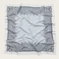Close-up detail of a floral print square scarf featuring delicate wavy scalloped edges - 110X110CM / Gray Blue Floral
