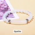 Elegant synthetic opal beaded bracelet with silver spacers on a warm beige background - 8mm Beads 10*39mm Tube / Opal
