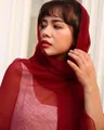 Close-up view of an elegant wine red textured chiffon scarf worn gracefully as a headscarf - Long (140-180cm) / Jujube Red