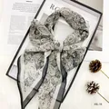 Close-up of cold-toned Paisley chiffon skinny scarf with hand-rolled edges for women - 160*20cm / PS-2