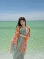 Elegant orange floral beach shawl with tassels for sun protection and vacation - 180cm / Setting Sun