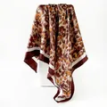 Elegant leopard print satin square scarf with a smooth silk-like finish and draped detail - Coffee