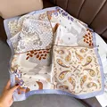 Detailed view of square satin scarf with paisley floral print and lilac border - Style 14 / 70x70cm