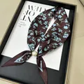 Elegant brown silk neck scarf with blue floral pattern and magnetic pearl buckle - Blue Floral