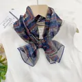 Elegant geometric print thin xili yarn scarf for women styled as a decorative neck bow - Charming Geometry
